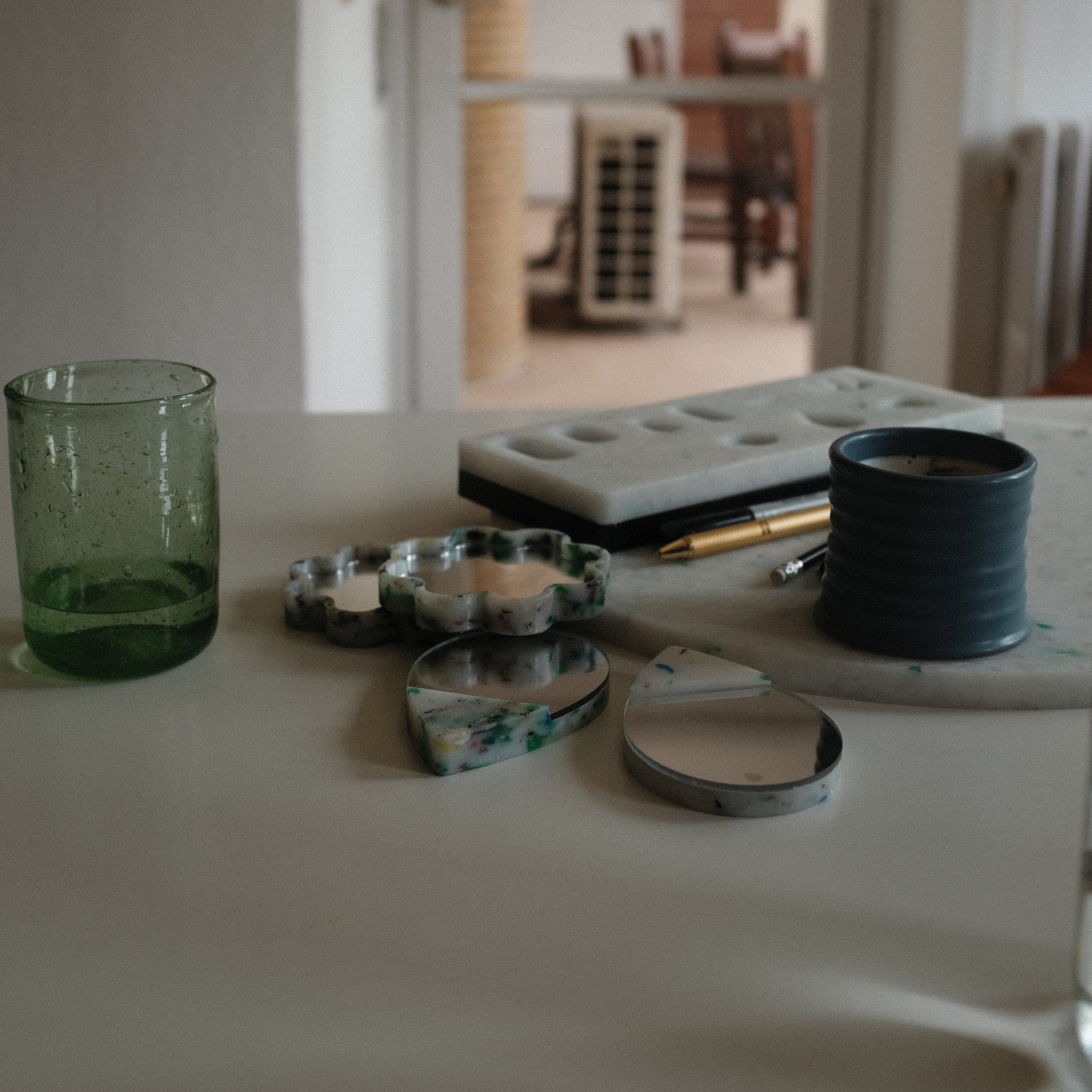DETAIL OF LARGE WHITE CIRCLE CHARCUTERIE CUTTING BOARD BY THE MINIMONO PROJECT - BRAND FOR ECO FRIENDLY - PLAYFUL - MULTI FUNCTIONAL - SUSTAINABLE - HIGH QUALITY - DESIGN FURNITURE FROM RECYCLED PLASTIC FOR BOTH ADULT AND CHILDREN MADE IN BERLIN GERMANY