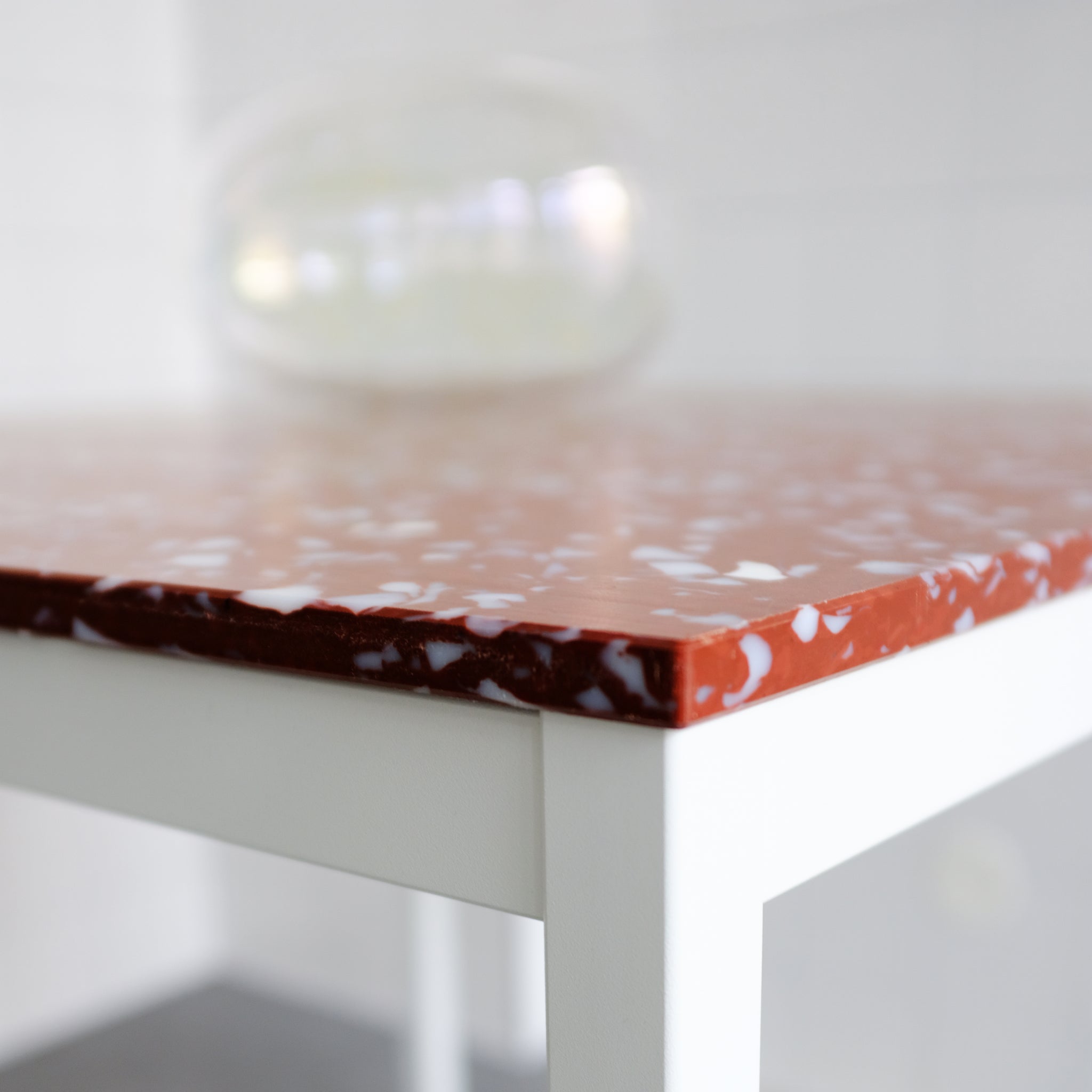 DETAIL OF RED TABLE TOP BY THE MINIMONO PROJECT - BRAND FOR ECO FRIENDLY - PLAYFUL - MULTI FUNCTIONAL - SUSTAINABLE - HIGH QUALITY - DESIGN FURNITURE FROM RECYCLED PLASTIC FOR BOTH ADULT AND CHILDREN MADE IN BERLIN GERMANY