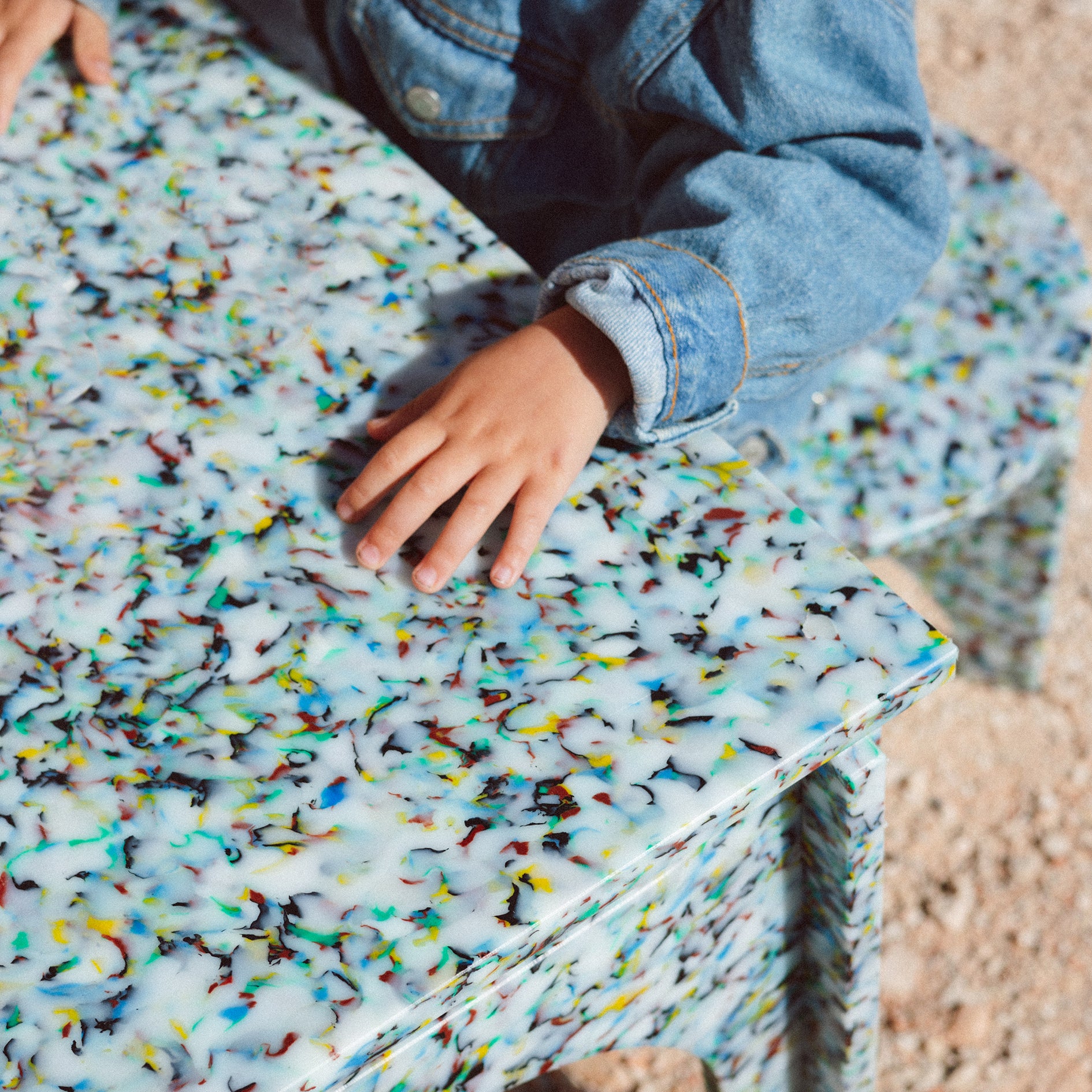 DETAIL OF COLOURFUL BENCH KIDS DESK BY THE MINIMONO PROJECT - BRAND FOR ECO FRIENDLY - PLAYFUL - MULTI FUNCTIONAL - SUSTAINABLE - HIGH QUALITY - DESIGN FURNITURE FROM RECYCLED PLASTIC FOR BOTH ADULT AND CHILDREN MADE IN BERLIN GERMANY