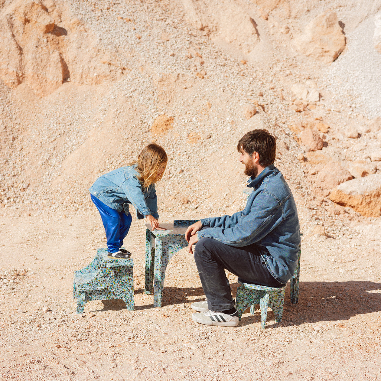 MIA STANDING ON COLOURFUL STEP STOOL BY THE MINIMONO PROJECT - BRAND FOR ECO FRIENDLY - PLAYFUL - MULTI FUNCTIONAL - SUSTAINABLE - HIGH QUALITY - DESIGN FURNITURE FROM RECYCLED PLASTIC FOR BOTH ADULT AND CHILDREN MADE IN BERLIN GERMANY