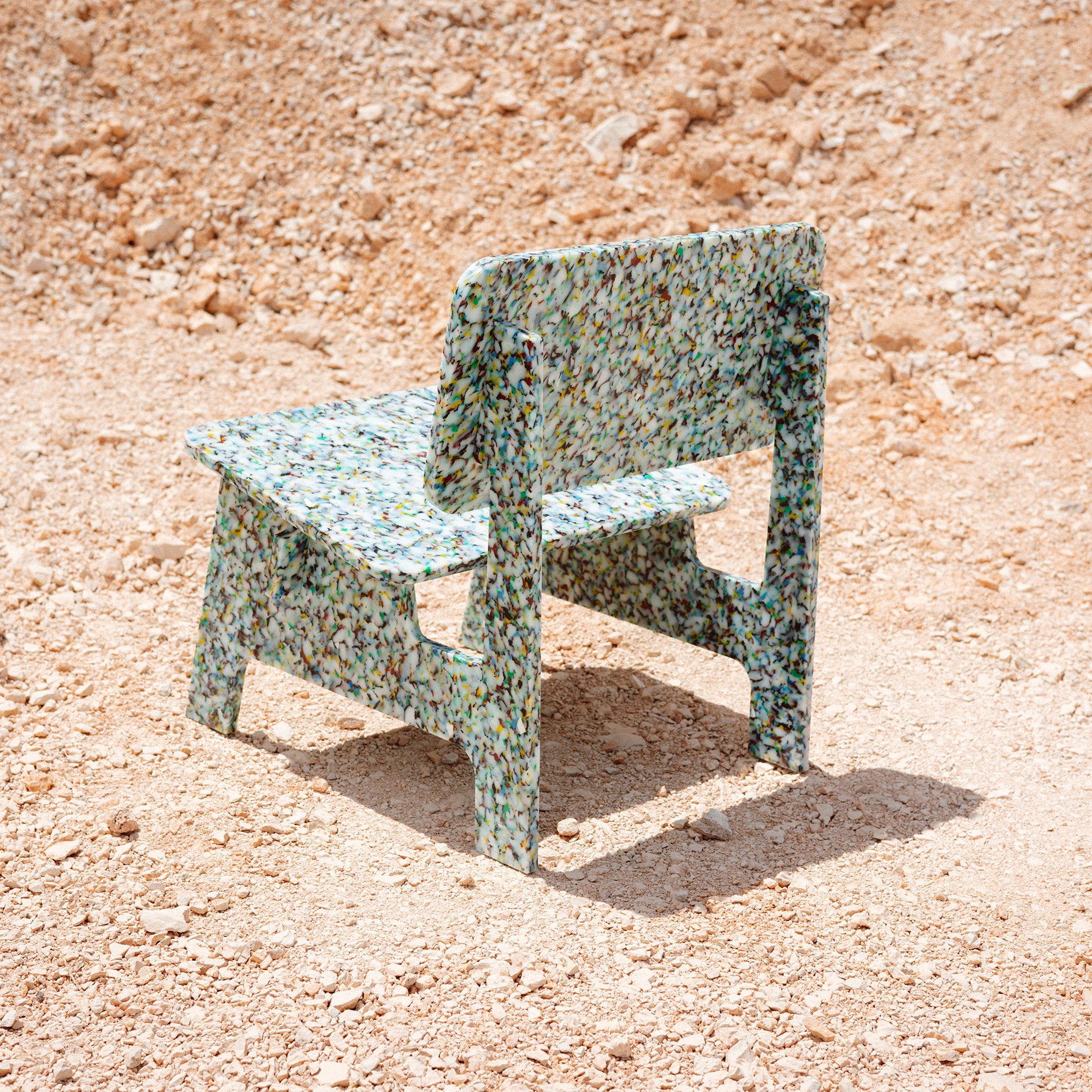 BACK VIEW OF COLOURFUL CHAIR BY THE MINIMONO PROJECT - BRAND FOR ECO FRIENDLY - PLAYFUL - MULTI FUNCTIONAL - SUSTAINABLE - HIGH QUALITY - DESIGN FURNITURE FROM RECYCLED PLASTIC FOR BOTH ADULT AND CHILDREN MADE IN BERLIN GERMANY