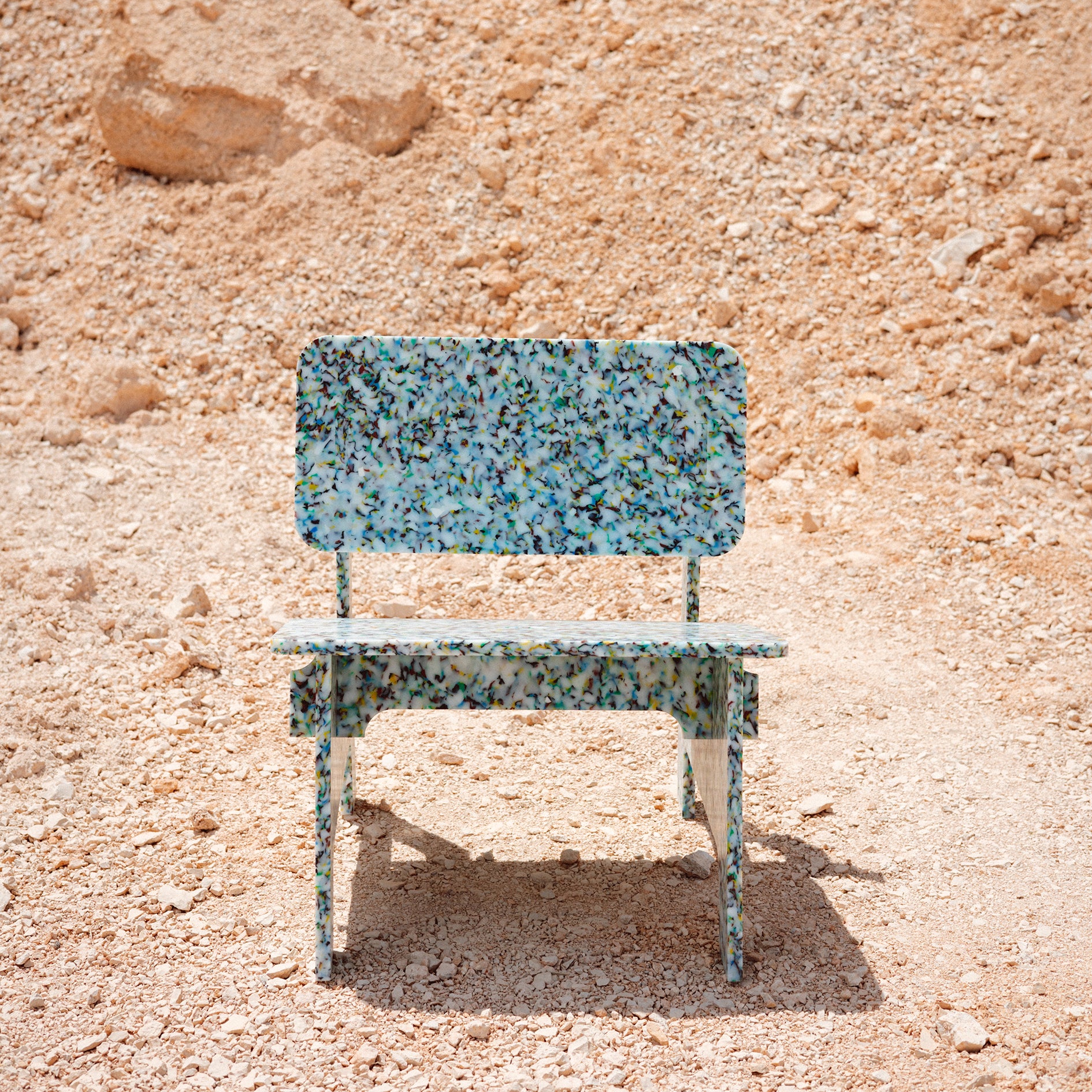 FRONT VIEW OF COLOURFUL CHAIR BY THE MINIMONO PROJECT - BRAND FOR ECO FRIENDLY - PLAYFUL - MULTI FUNCTIONAL - SUSTAINABLE - HIGH QUALITY - DESIGN FURNITURE FROM RECYCLED PLASTIC FOR BOTH ADULT AND CHILDREN MADE IN BERLIN GERMANY