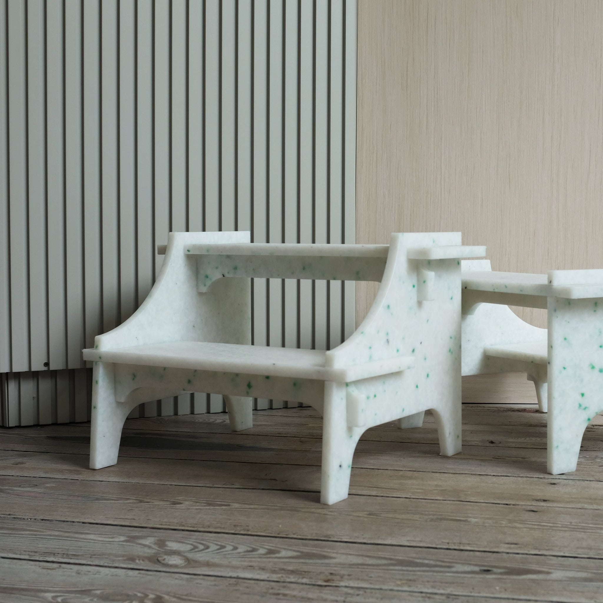 TWO DIFFERENT WHITE STEP STOOLS BY THE MINIMONO PROJECT - BRAND FOR ECO FRIENDLY - PLAYFUL - MULTI FUNCTIONAL - SUSTAINABLE - HIGH QUALITY - DESIGN FURNITURE FROM RECYCLED PLASTIC FOR BOTH ADULT AND CHILDREN MADE IN BERLIN GERMANY