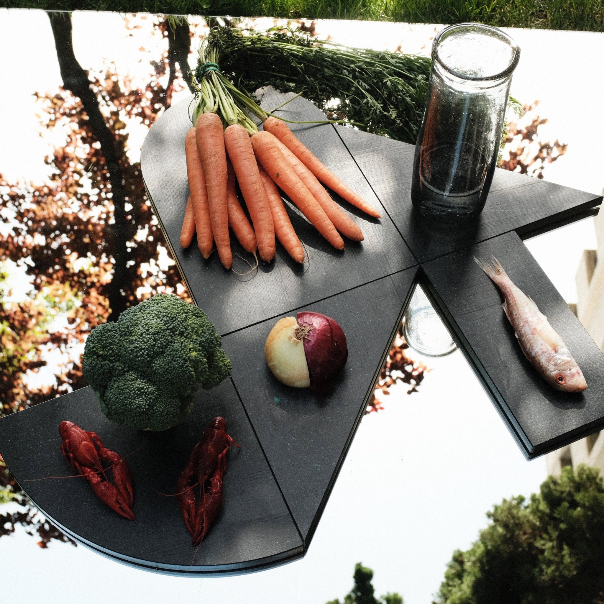SET OF BLACK CHARCUTERIE CUTTING BOARDS ON MIRROR BY THE MINIMONO PROJECT - BRAND FOR ECO FRIENDLY - PLAYFUL - MULTI FUNCTIONAL - SUSTAINABLE - HIGH QUALITY - DESIGN FURNITURE FROM RECYCLED PLASTIC FOR BOTH ADULT AND CHILDREN MADE IN BERLIN GERMANY