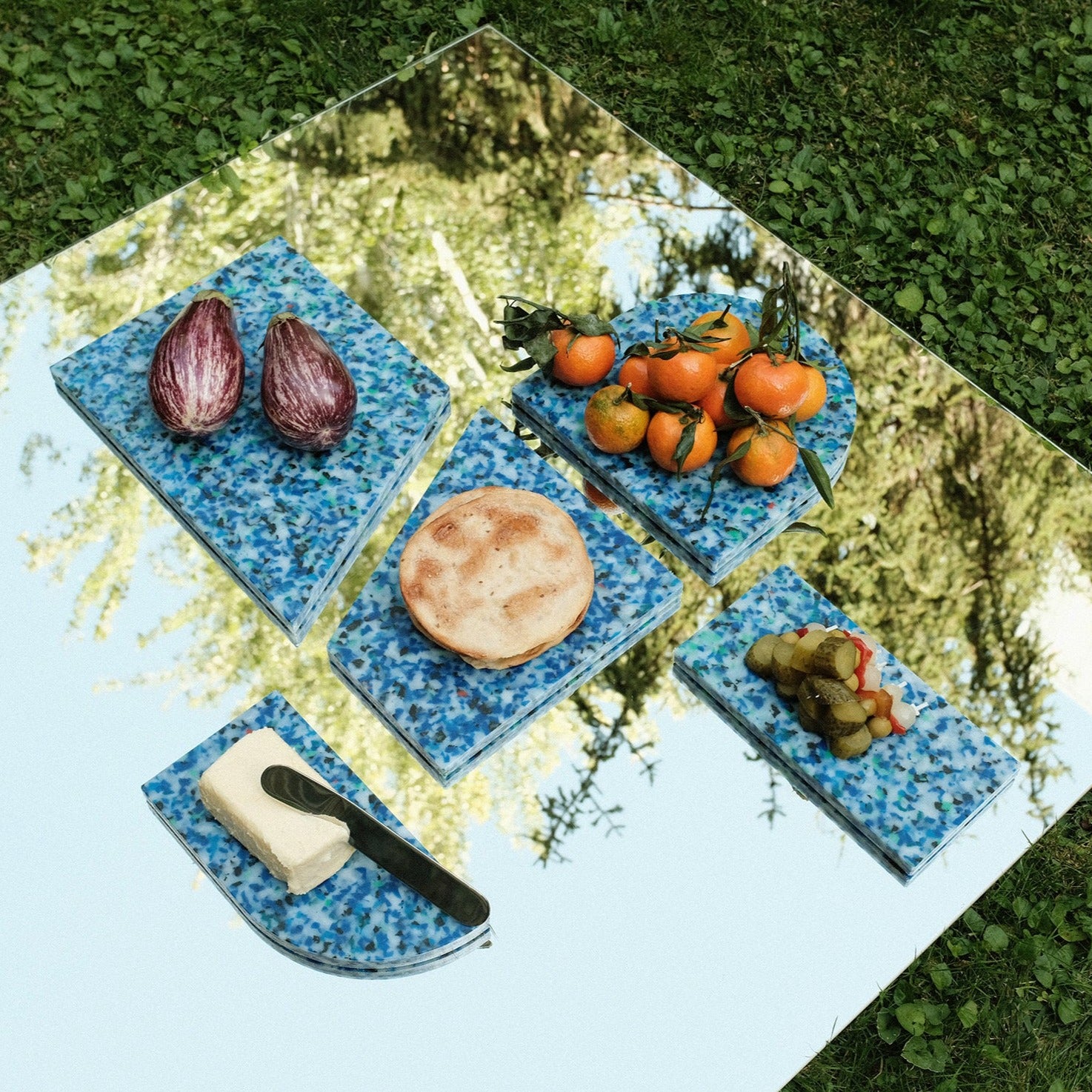 SET OF BLUE CHARCUTERIE CUTTING BOARDS ON MIRROR BY THE MINIMONO PROJECT - BRAND FOR ECO FRIENDLY - PLAYFUL - MULTI FUNCTIONAL - SUSTAINABLE - HIGH QUALITY - DESIGN FURNITURE FROM RECYCLED PLASTIC FOR BOTH ADULT AND CHILDREN MADE IN BERLIN GERMANY