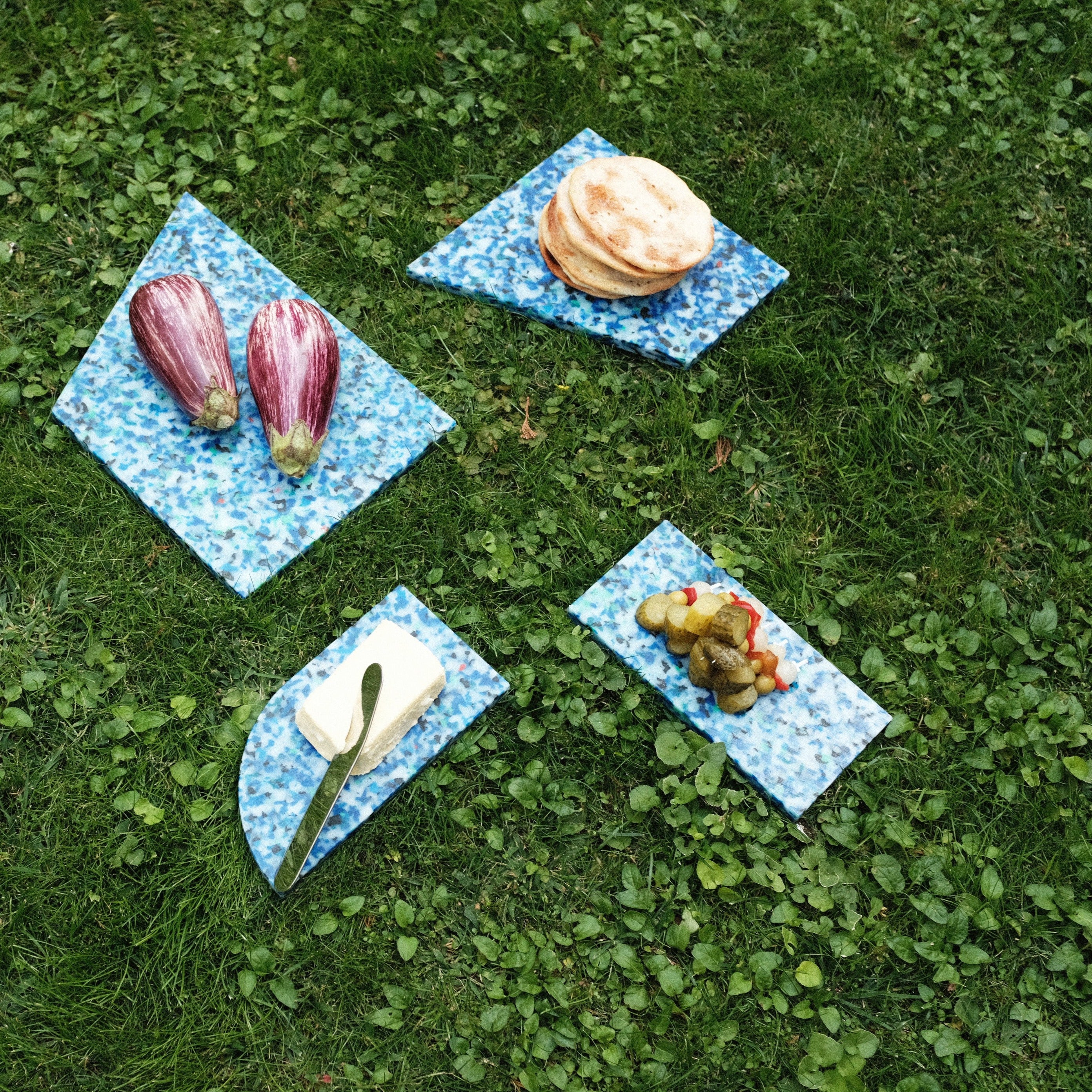 SET OF BLUE CHARCUTERIE CUTTING BOARDS AT PICNIC BY THE MINIMONO PROJECT - BRAND FOR ECO FRIENDLY - PLAYFUL - MULTI FUNCTIONAL - SUSTAINABLE - HIGH QUALITY - DESIGN FURNITURE FROM RECYCLED PLASTIC FOR BOTH ADULT AND CHILDREN MADE IN BERLIN GERMANY