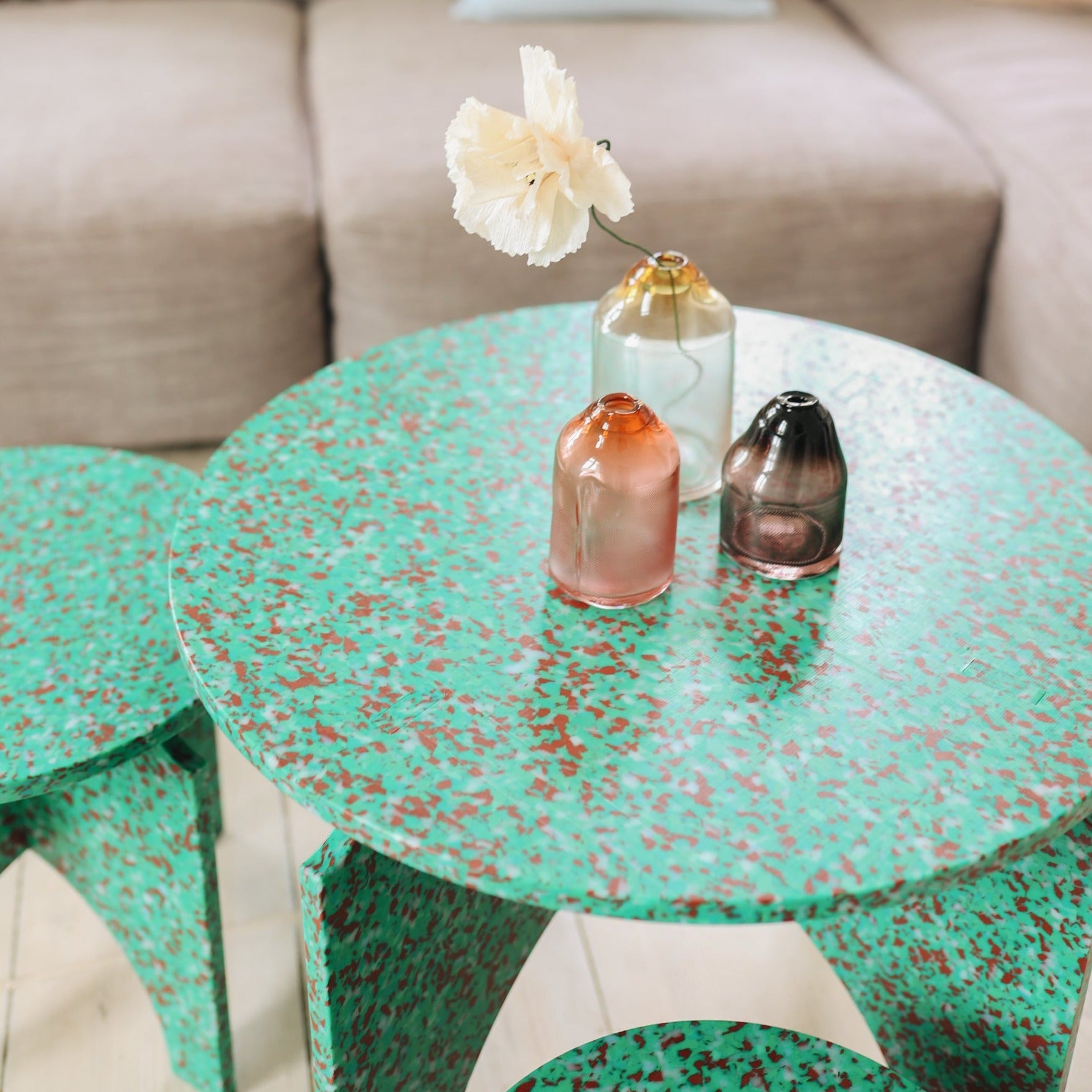 MILENA KLING VASES ON TOP OF GREEN TABLE BY THE MINIMONO PROJECT - BRAND FOR ECO FRIENDLY - PLAYFUL - MULTI FUNCTIONAL - SUSTAINABLE - HIGH QUALITY - DESIGN FURNITURE FROM RECYCLED PLASTIC FOR BOTH ADULT AND CHILDREN MADE IN BERLIN GERMANY