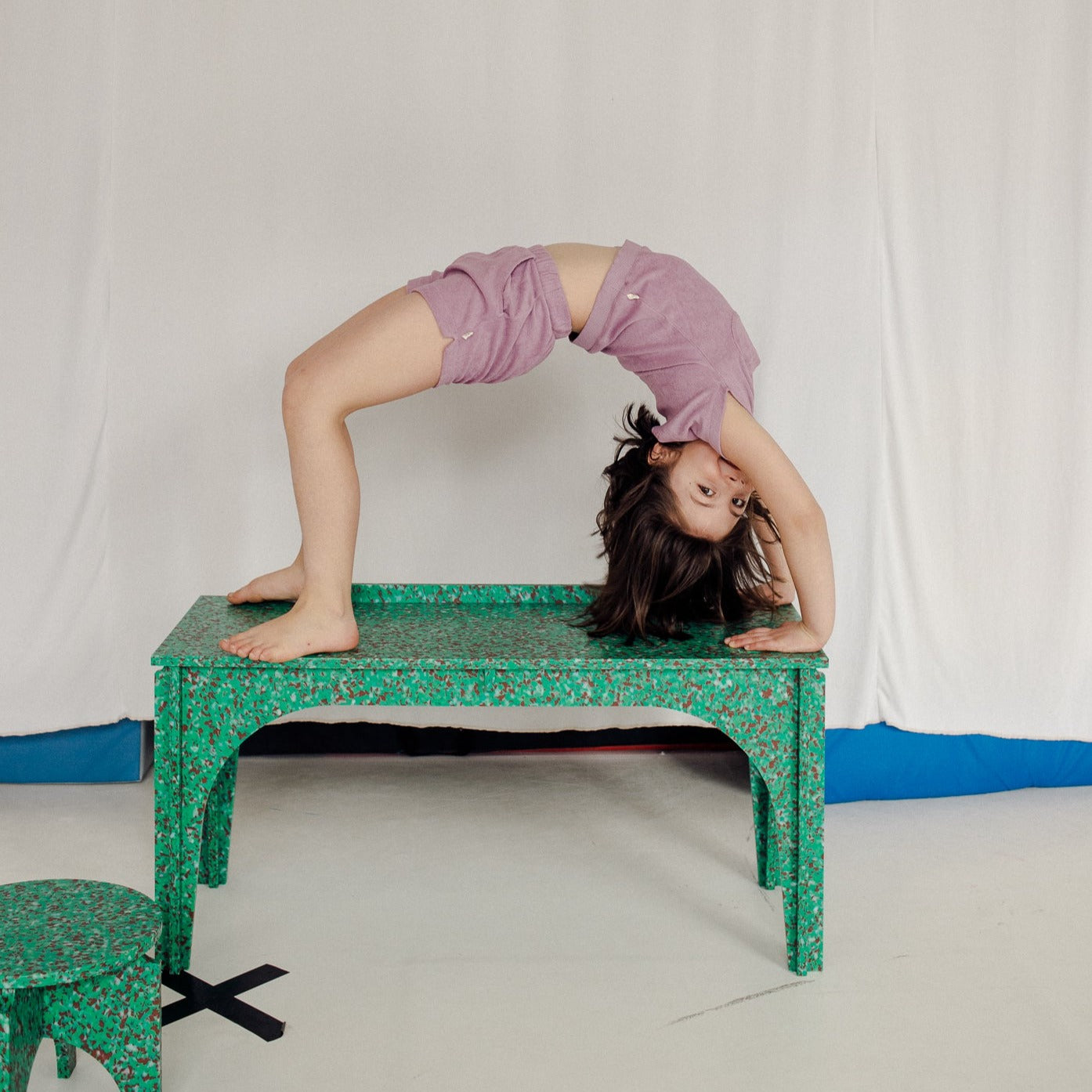 ACROBATIC KID ON GREEN BENCH KIDS DESK BY THE MINIMONO PROJECT - BRAND FOR ECO FRIENDLY - PLAYFUL - MULTI FUNCTIONAL - SUSTAINABLE - HIGH QUALITY - DESIGN FURNITURE FROM RECYCLED PLASTIC FOR BOTH ADULT AND CHILDREN MADE IN BERLIN GERMANY