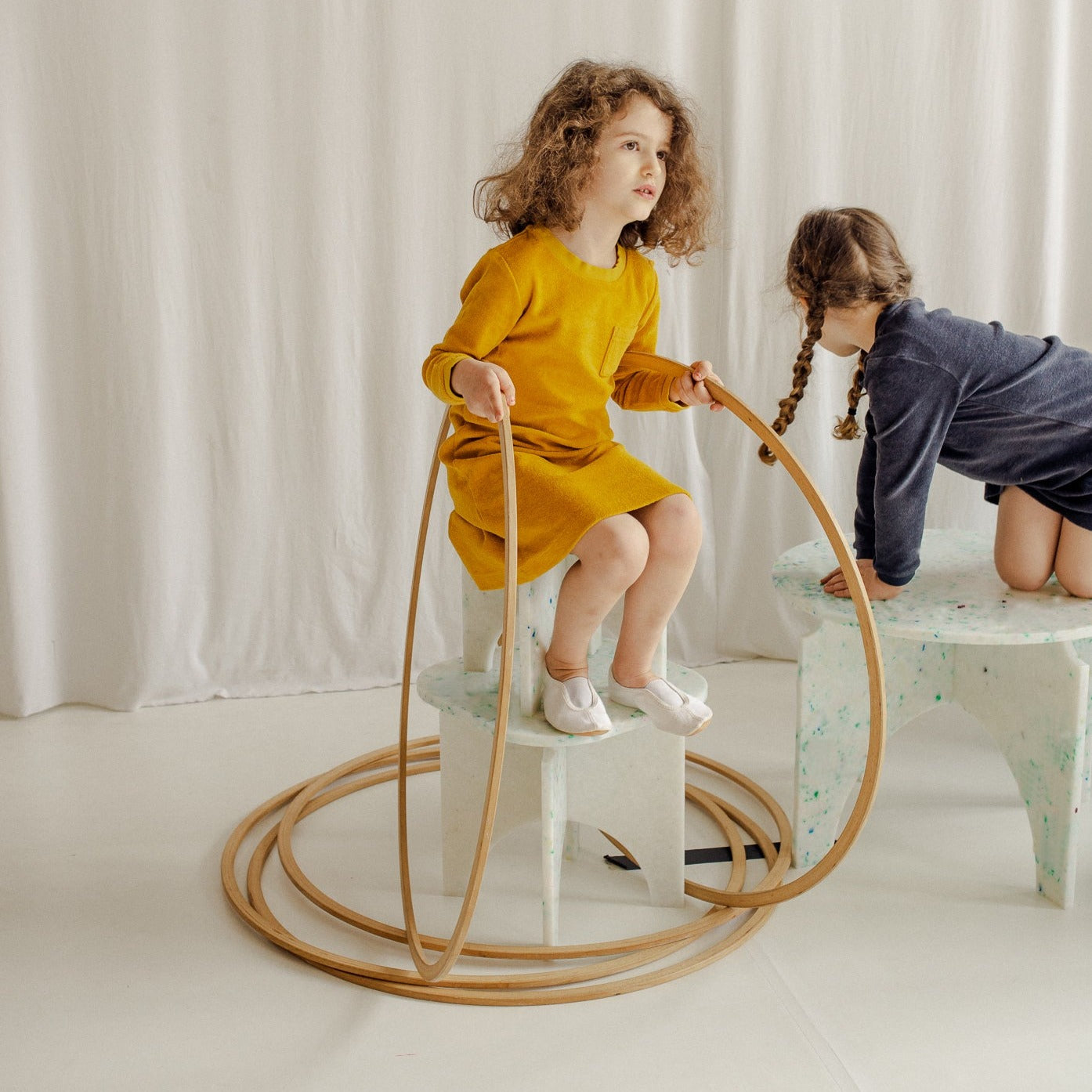 KIDS PLAYING ON TABLE AND STOOL BY THE MINIMONO PROJECT - BRAND FOR ECO FRIENDLY - PLAYFUL - MULTI FUNCTIONAL - SUSTAINABLE - HIGH QUALITY - DESIGN FURNITURE FROM RECYCLED PLASTIC FOR BOTH ADULT AND CHILDREN MADE IN BERLIN GERMANY