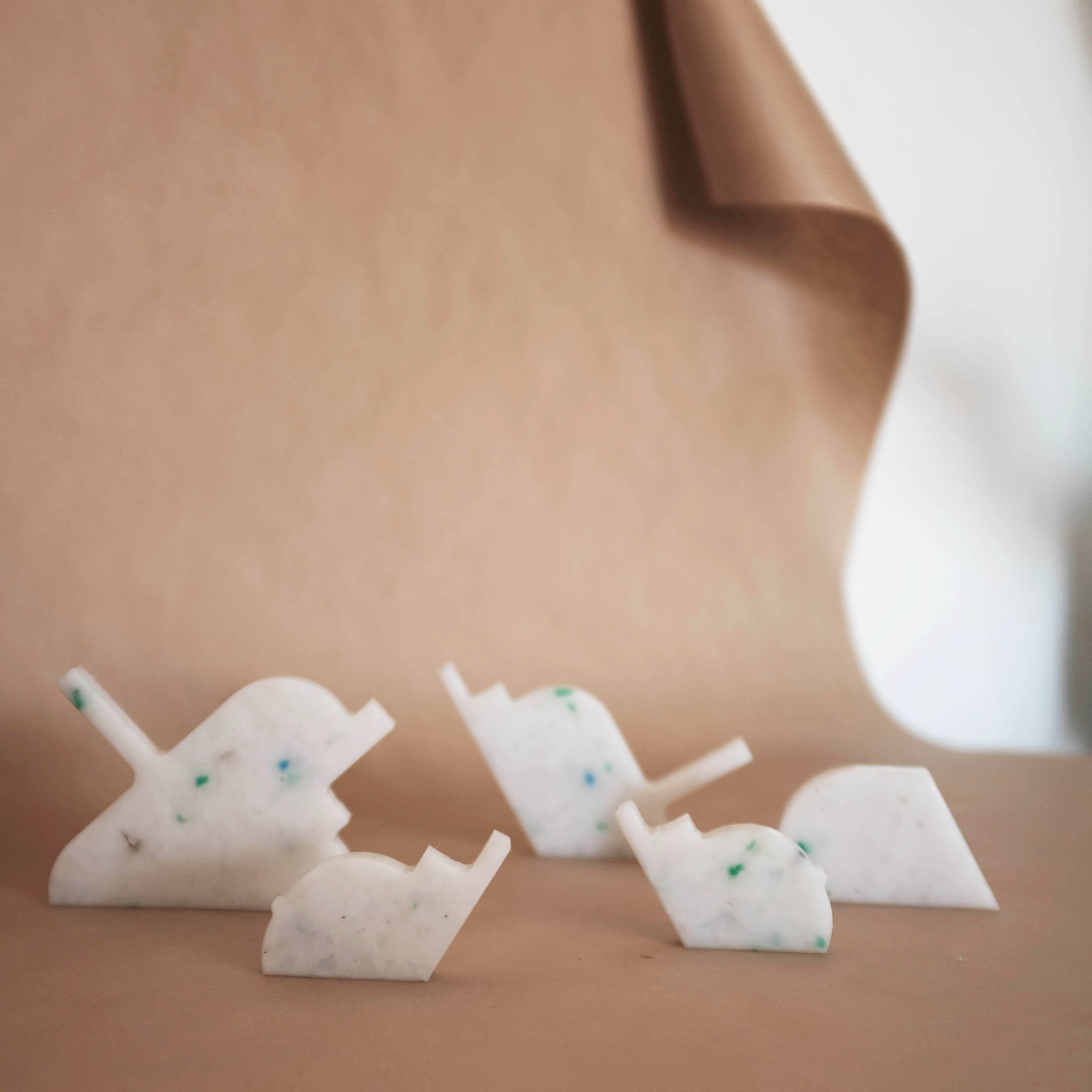 WHITE WALL HOOKS FROM RANDOM PRODUCTION CUT OFFS BY THE MINIMONO PROJECT - BRAND FOR ECO FRIENDLY - PLAYFUL - MULTI FUNCTIONAL - SUSTAINABLE - HIGH QUALITY - DESIGN FURNITURE FROM RECYCLED PLASTIC FOR BOTH ADULT AND CHILDREN MADE IN BERLIN GERMANY