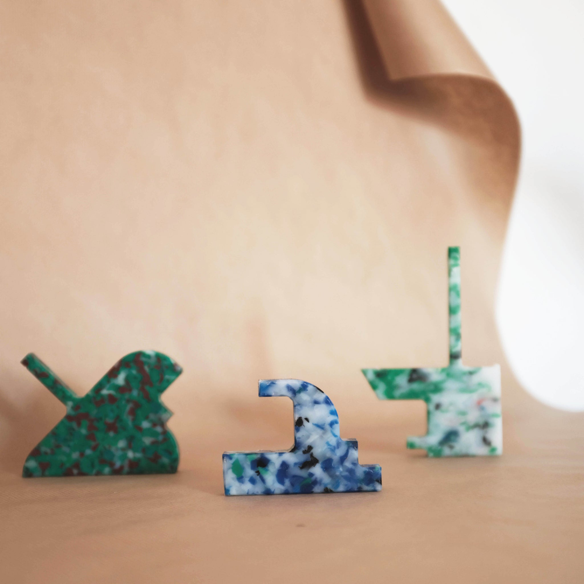 MIXED COLOUR WALL HOOKS FROM RANDOM PRODUCTION CUT OFFS BY THE MINIMONO PROJECT - BRAND FOR ECO FRIENDLY - PLAYFUL - MULTI FUNCTIONAL - SUSTAINABLE - HIGH QUALITY - DESIGN FURNITURE FROM RECYCLED PLASTIC FOR BOTH ADULT AND CHILDREN MADE IN BERLIN GERMANY