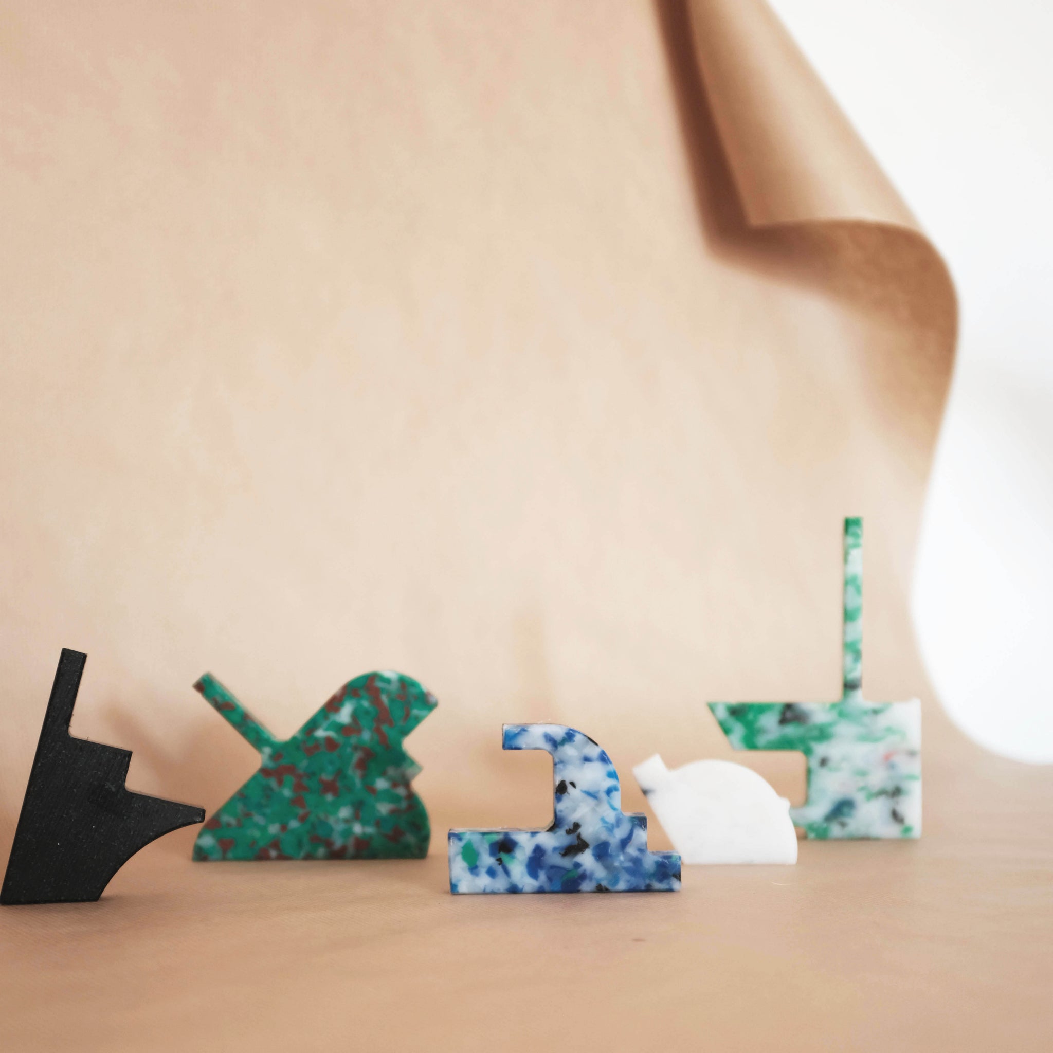 MIXED COLOUR WALL HOOKS FROM RANDOM PRODUCTION CUT OFFS BY THE MINIMONO PROJECT - BRAND FOR ECO FRIENDLY - PLAYFUL - MULTI FUNCTIONAL - SUSTAINABLE - HIGH QUALITY - DESIGN FURNITURE FROM RECYCLED PLASTIC FOR BOTH ADULT AND CHILDREN MADE IN BERLIN GERMANY